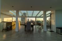 A television and/or entertainment centre at Luxury Penthouse with Stunning View and Hammam