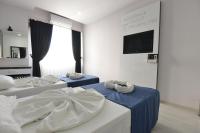 Postel nebo postele na pokoji v ubytování La Rezidans Hotel