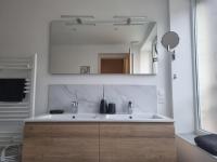 a bathroom with a sink and a mirror at Chez Clement et Mathilde - T2 hyper centre tout équipé in Saint-Amand-les-Eaux