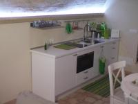 A kitchen or kitchenette at La Grotta