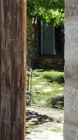 an open door to a building with a window at Les papillons in Agnat