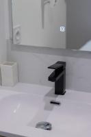 a bathroom with a black sink and a mirror at L&#39;Écrin De L&#39;Hyper Centre in La Rochelle