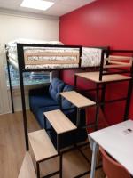 a room with a bunk bed and a couch at STUDIO AVEC TERRASSE DONNANT SUR UN PARC ABORE in Bourg-en-Bresse