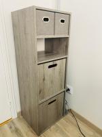 a wooden book shelf with two drawers in a room at Studio centre village Soligny la Trappe proche Mortagne au perche in Soligny-la-Trappe