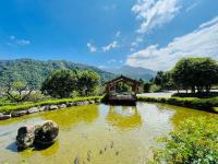 a river with a pavilion in the middle at Ying Shih Guest House in Datong