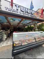 a display case in front of a food court at GP House Phuket Patong Beach in Patong Beach
