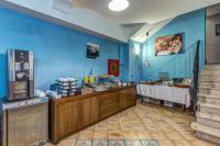 a restaurant with a table and a blue wall at Hotel Nice in Sorrento