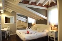 Postel nebo postele na pokoji v ubytování Hotel Spa San Marcos