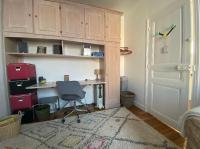 a room with a desk and a chair and a door at Maison confortable avec jardin à 2 pas de Paris in Fontenay-sous-Bois