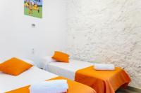 Posteľ alebo postele v izbe v ubytovaní Apartamentos Tito San Nicolas