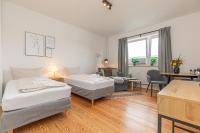 Postel nebo postele na pokoji v ubytování fewo1846 - Kommood - zentral gelegenes Studio-Apartment mit Balkon im Hochparterre