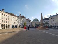 a city square with a statue in front of buildings at Appartement Disney Paris in Serris