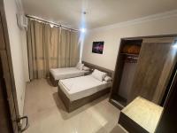 A bed or beds in a room at MARINA SKY