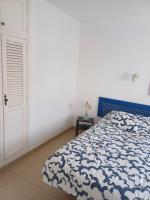 Posteľ alebo postele v izbe v ubytovaní T2 RESIDENCE ATALAYA PUERTO DEL CARMEN LANZAROTE