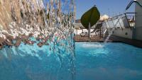 The swimming pool at or close to Ako Suite Hotel