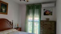 A bed or beds in a room at Apartamento en la Barrosa