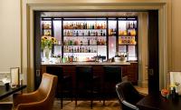 a bar in a restaurant with a window at The Gainsborough Bath Spa - Small Luxury Hotels of the World in Bath