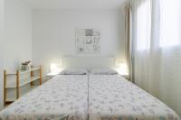 Postel nebo postele na pokoji v ubytování Flatguest Arinaga Playa 4 Caracola