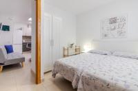 Postel nebo postele na pokoji v ubytování Flatguest Arinaga Playa 4 Caracola