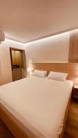 Postel nebo postele na pokoji v ubytování Hotel La Colonia