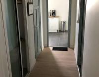 an empty hallway with a hallway leading into a room at Chambre qualité hôtel 4 etoiles dans un appartement partagé in Frouzins