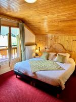 Ein Bett oder Betten in einem Zimmer der Unterkunft Hameau des Prodains - H&ocirc;tel