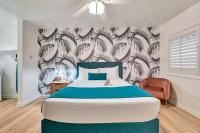a bedroom with a bed and a wall with feathers at Santa Monica Hotel in Los Angeles