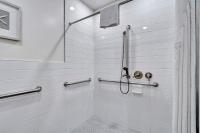 a bathroom with a shower with a shower curtain at Santa Monica Hotel in Los Angeles