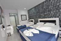 Postel nebo postele na pokoji v ubytování La Rezidans Hotel