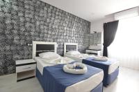 Postel nebo postele na pokoji v ubytování La Rezidans Hotel