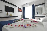 Postel nebo postele na pokoji v ubytování La Rezidans Hotel