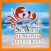 a sign for a seafood restaurant on the beach at PCB BEACH RESORT in Kota Bharu