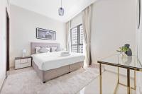 Postel nebo postele na pokoji v ubytování StoneTree - Modern 1 BR Apartment in Dubai Marina