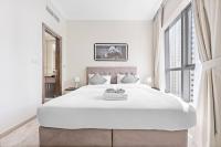 Postel nebo postele na pokoji v ubytování StoneTree - Modern 1 BR Apartment in Dubai Marina
