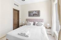 Postel nebo postele na pokoji v ubytování StoneTree - Modern 1 BR Apartment in Dubai Marina