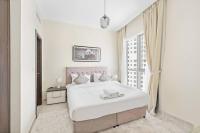 Postel nebo postele na pokoji v ubytování StoneTree - Modern 1 BR Apartment in Dubai Marina