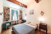 a bedroom with a bed and a desk and a chair at Michelet in Collioure