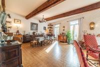 a living room with a table and a dining room at Michelet in Collioure