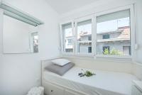Postel nebo postele na pokoji v ubytování City Smart Apartment