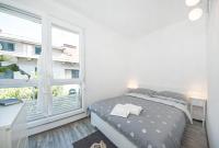 Postel nebo postele na pokoji v ubytování City Smart Apartment