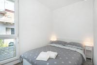 Postel nebo postele na pokoji v ubytování City Smart Apartment