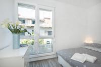 Postel nebo postele na pokoji v ubytování City Smart Apartment