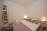 Postel nebo postele na pokoji v ubytování City Smart Apartment
