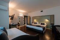 A bed or beds in a room at Hotel Buonconsiglio