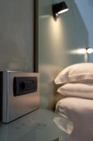A bed or beds in a room at Hotel Buonconsiglio