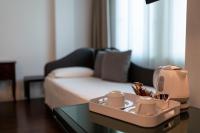 A bed or beds in a room at Hotel Buonconsiglio