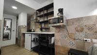 Kuchyň nebo kuchyňský kout v ubytování РUEВLO МAR, hotel-apartamento