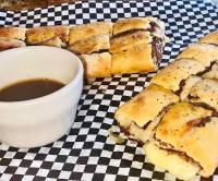 a plate of sandwiches next to a cup of coffee at Alhonna Resort in Lake Ozark