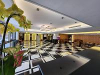 a lobby with a black and white checkered floor at Shihzuwan Hotel – Kaohsiung Station in Kaohsiung