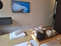 TV a/nebo společenská místnost v ubytování Paramount Gardens Resorts D204
